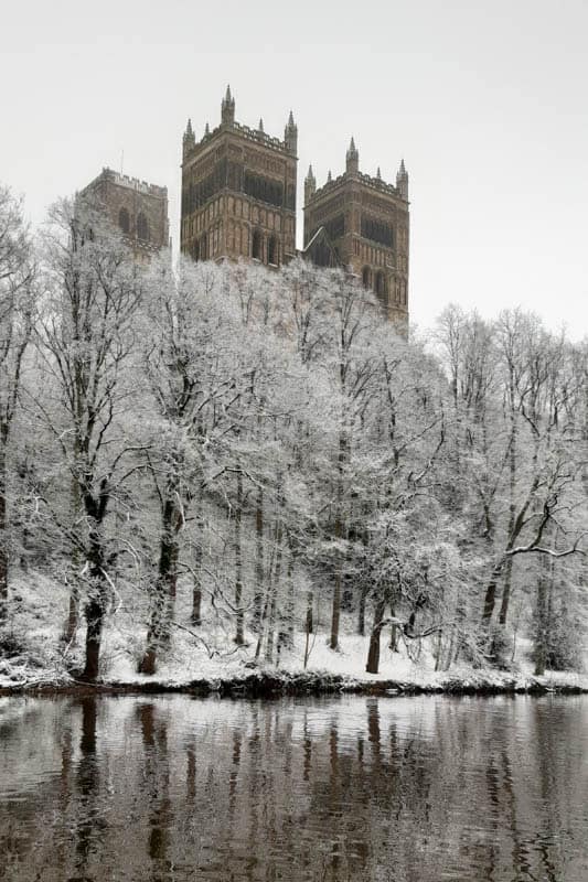 View of Durham Cathedral taken from across the River Wear on snowy day by Alchemi Art