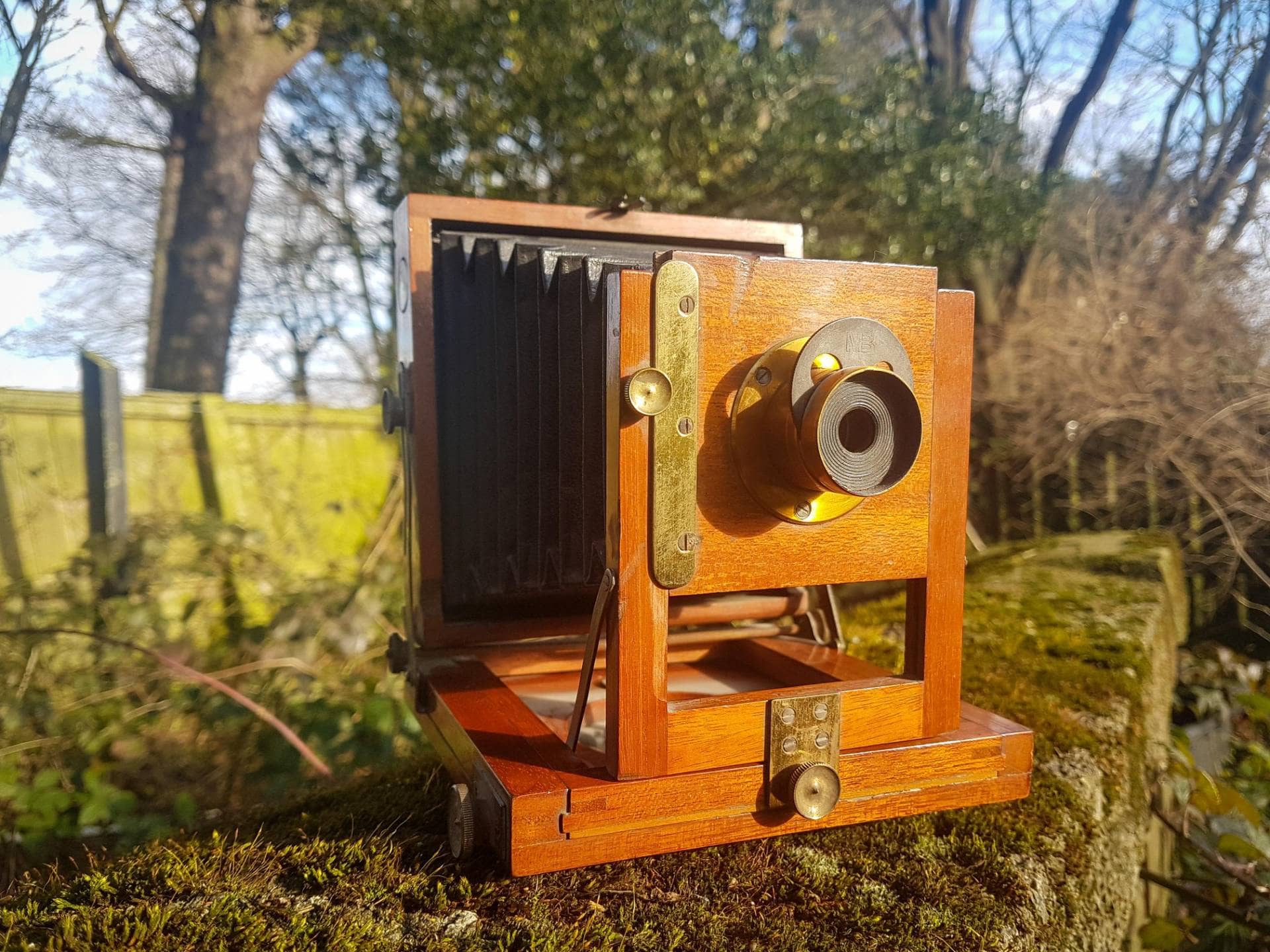Old Vintage Wooden Camera ready to take a photograph outside